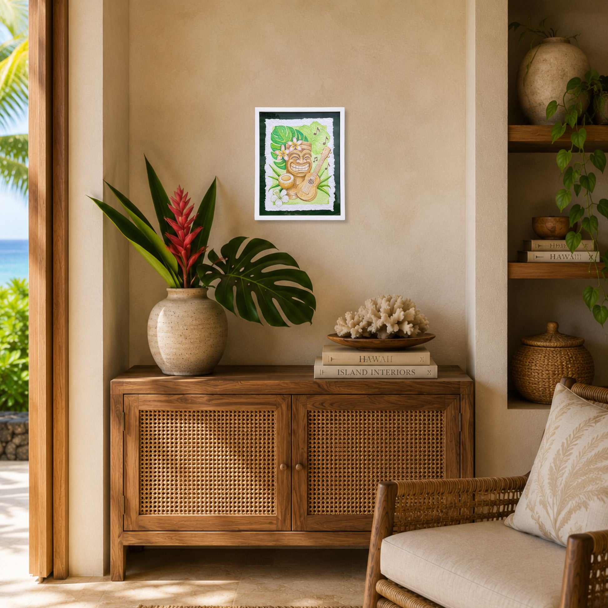 Living room with wooden cabinet, decorative items, and a painting on the wall. Framed artwork of a tiki , ukulele, and tropical flowers with leaves on a green background. Aloha Mele, watercolor painting on handmade paper, by Liliane Avalos, Kauai Hawaii 2026. Framed artwork of a tiki, ukulele, and tropical leaves with flowers on a green background.