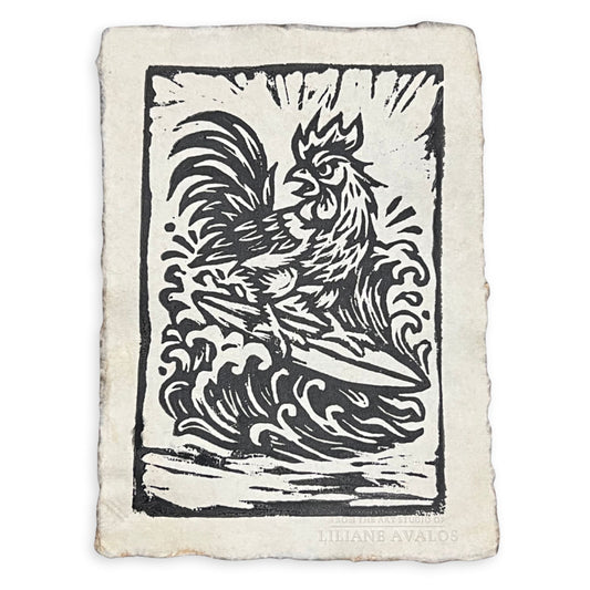 Woodcut-style illustration of a rooster on a textured paper, custom embossed with Liliane Avalos signature on white background. Artwork by Liliane Avalos, Kauai Hawaii artist