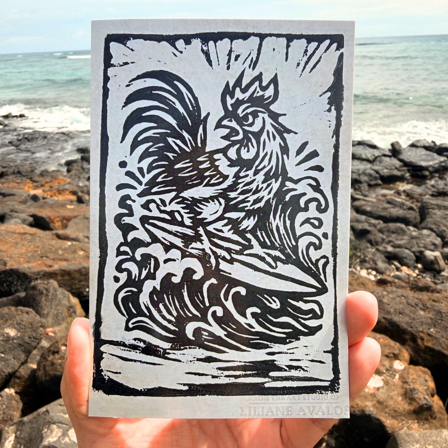 Surfing Rooster Hawaii art greeting card featuring playful island rooster surfing artwork by Liliane Avalos