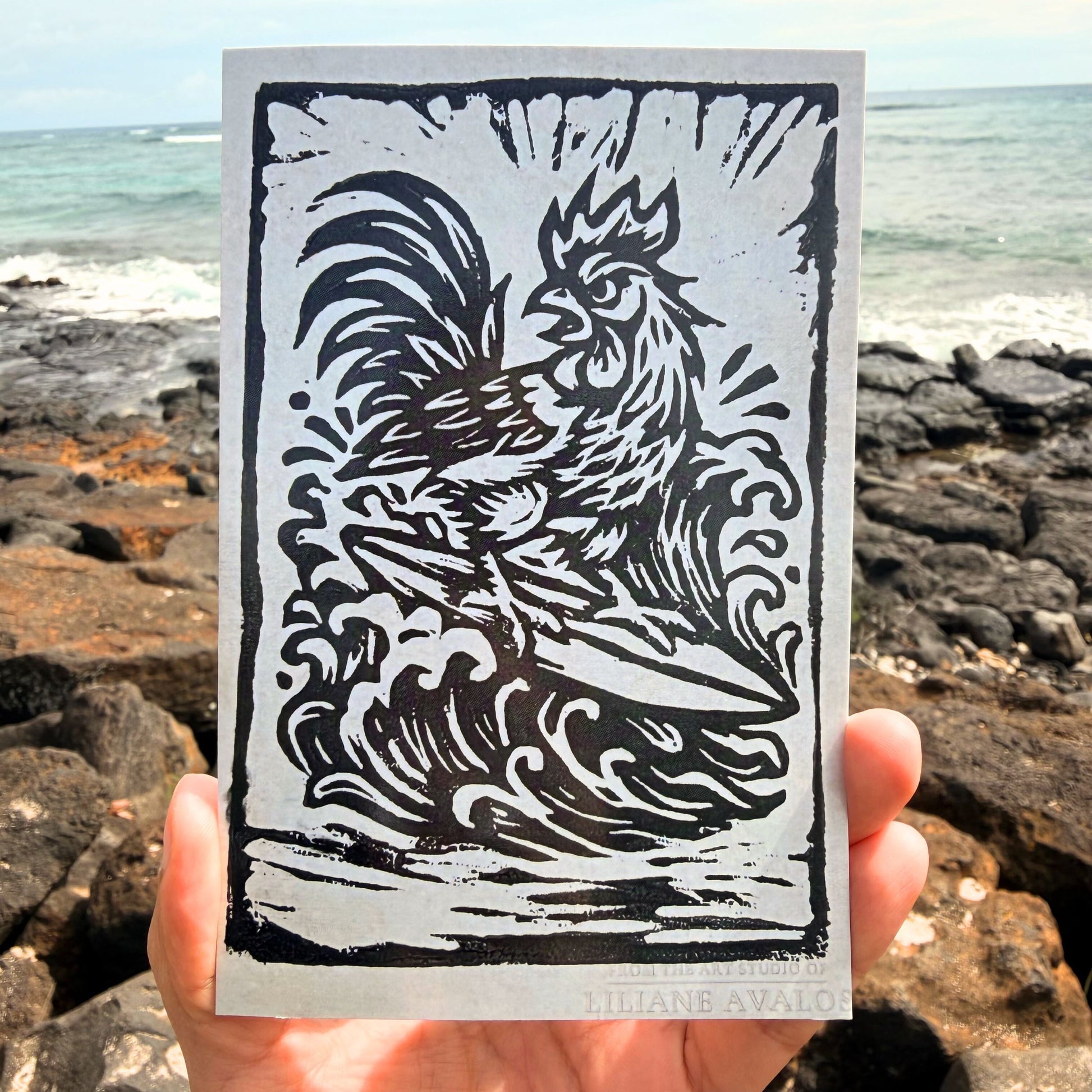Surfing Rooster Hawaii art greeting card featuring playful island rooster surfing artwork by Liliane Avalos