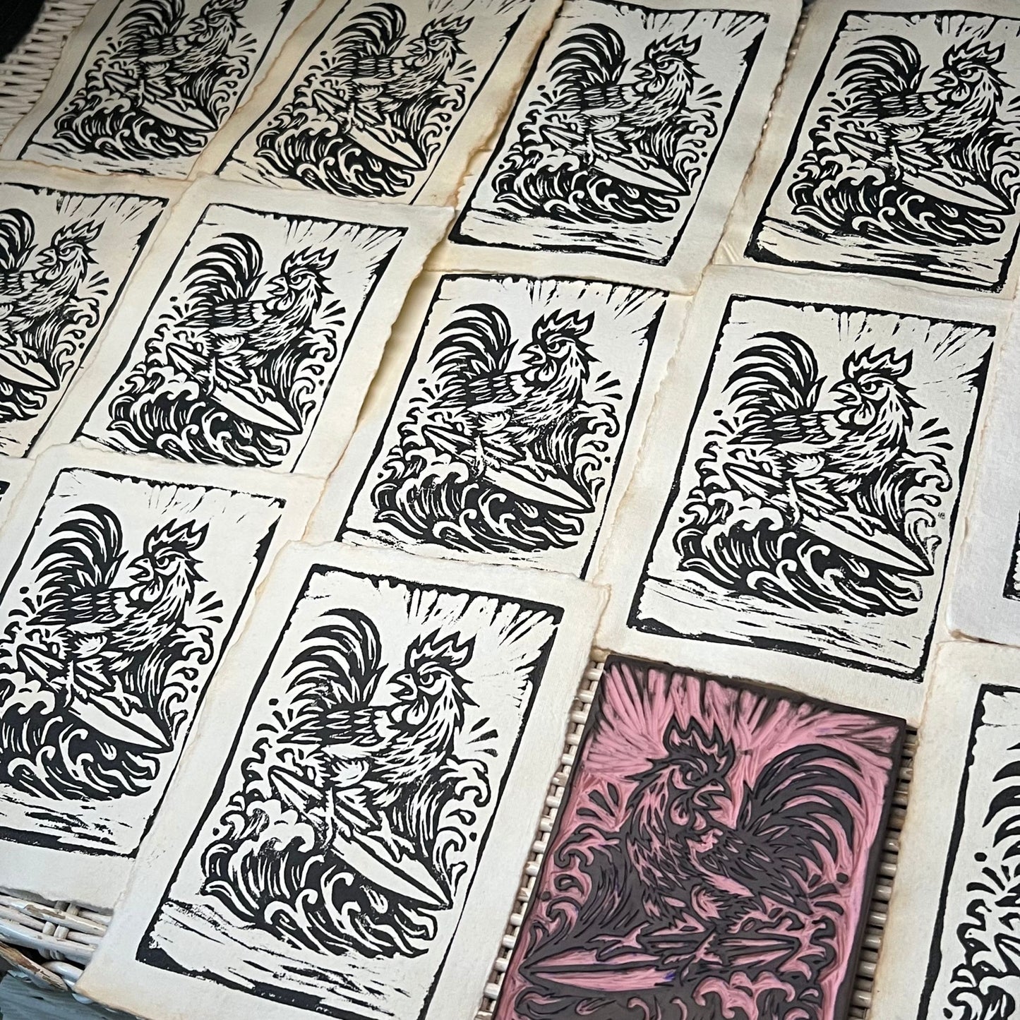 Surfing Rooster linocut print edition and carved linoleum block printmaking process by liliane avalos kauai hawaii artist